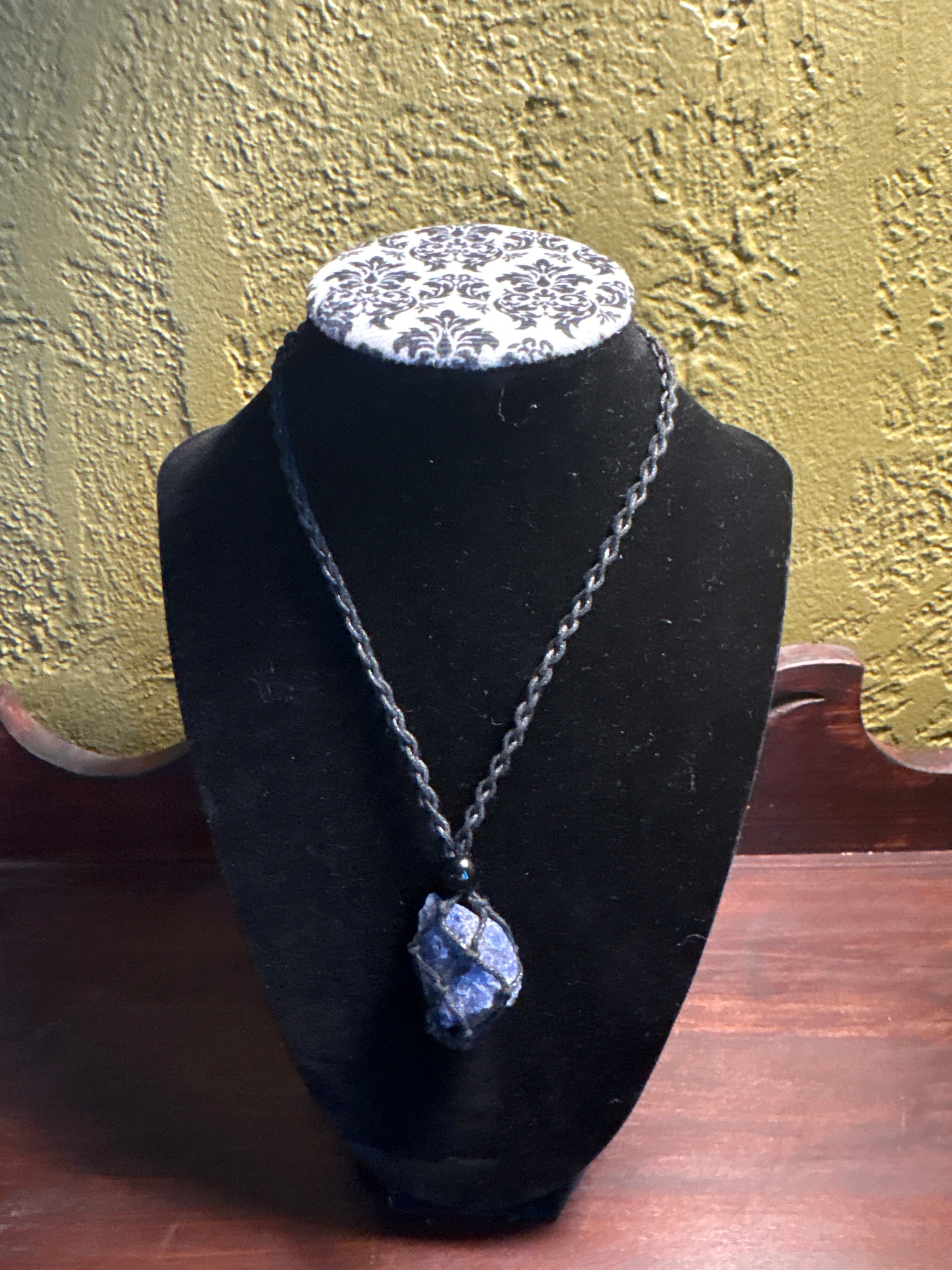 Braided crystal cage necklace
